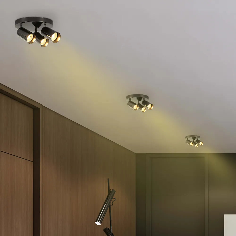Moderno foco cilíndrico en gris perla iluminando una sala de estar con decoración contemporánea, mejorando la ambientación y la funcionalidad.172-030394