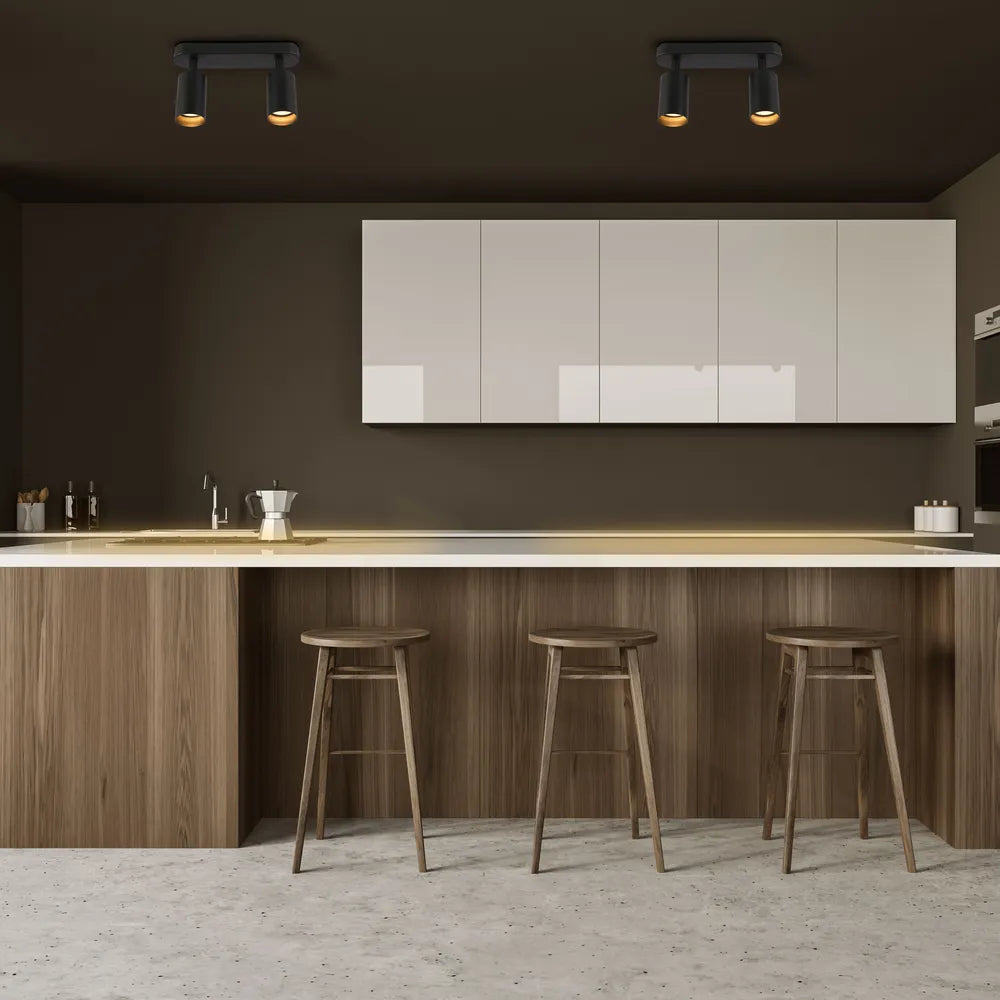 Foco moderno de cilindro de haz GU10 que realza una sala de estar elegante con decoración minimalista y una cálida ambientación de iluminación.172-03049