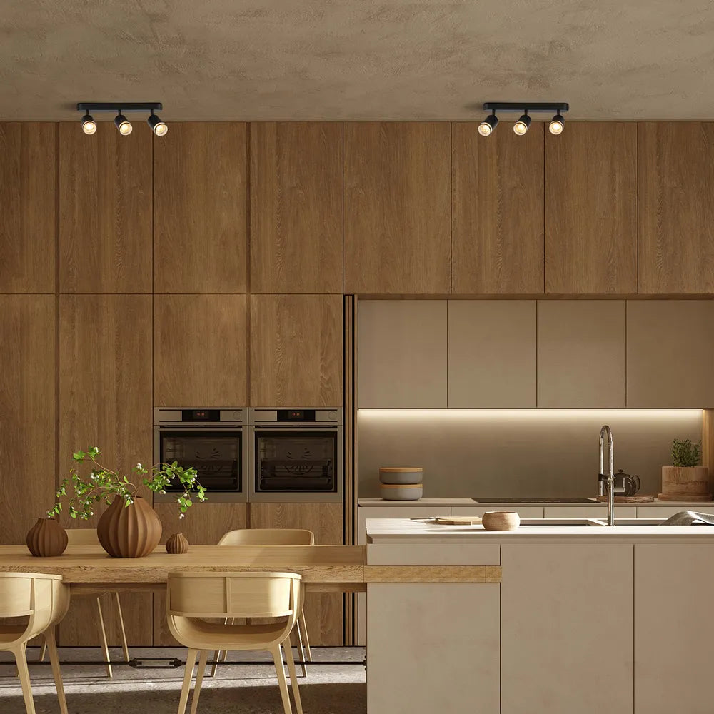 Foco circular GU10 iluminando una sala de estar moderna con decoración elegante e iluminación ambiental.172-03037