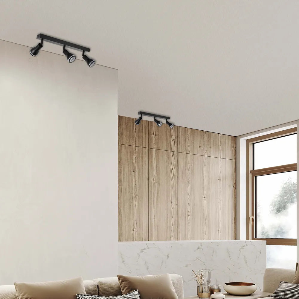Foco moderno GU10 iluminando una sala de estar elegante con una decoración minimalista, mejorando el ambiente acogedor y el diseño elegante.172-03212