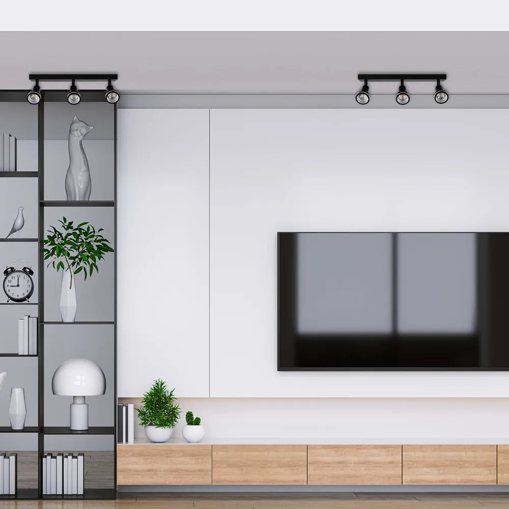 Foco de techo moderno Luma Cylindro GU10 que ilumina una sala de estar contemporánea con decoración elegante y ambiente sofisticado.172-03212