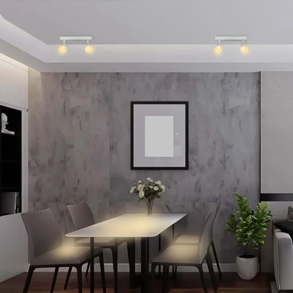 Reflector Sleek Luma Cylindro GU10 iluminando una sala de estar moderna con una decoración elegante, añadiendo un toque de sofisticación y calidez.172-03218