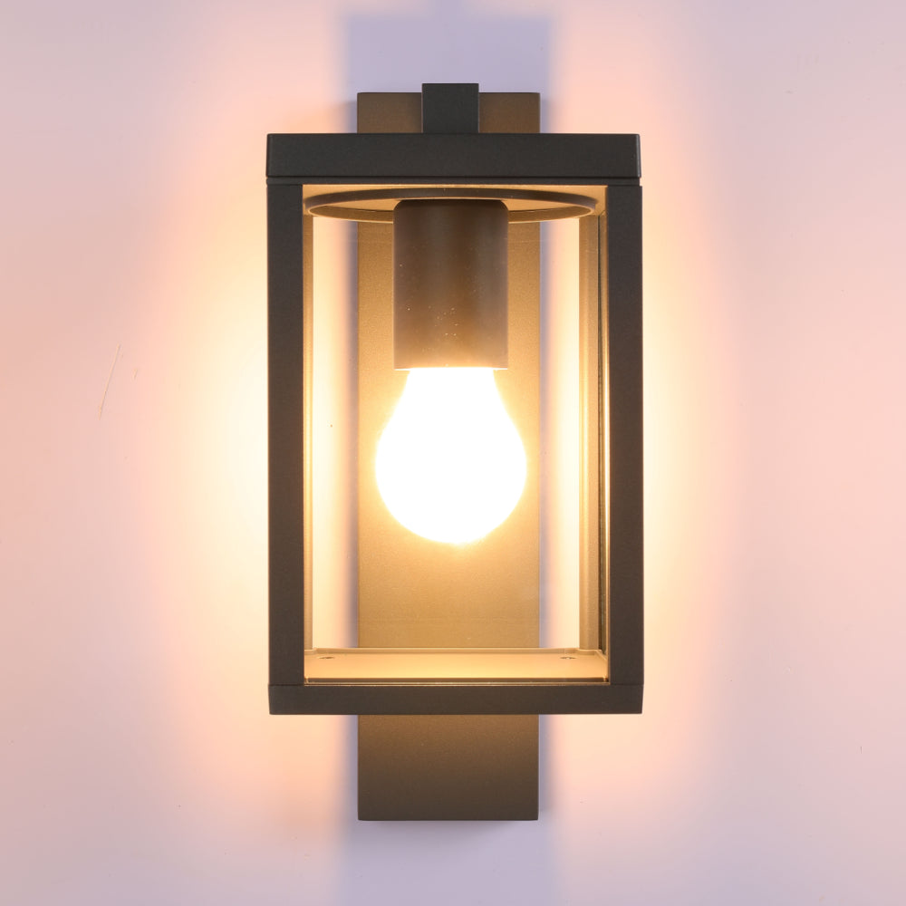 Lámpara de pared exterior en gris oscuro, perfecta para iluminar entradas con estilo moderno y resistente a la intemperie.