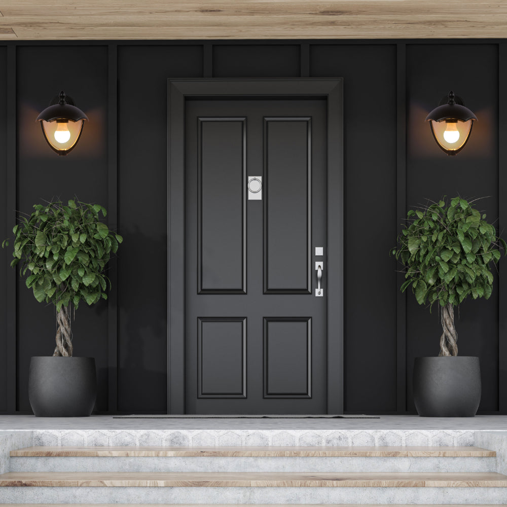 Lámpara de pared exterior en estilo industrial, ideal para jardines y entradas, con diseño negro y boca E27.