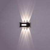 Aplique de pared LED moderno en negro, ideal para salas contemporáneas, proporcionando luz arriba y abajo para un ambiente elegante.