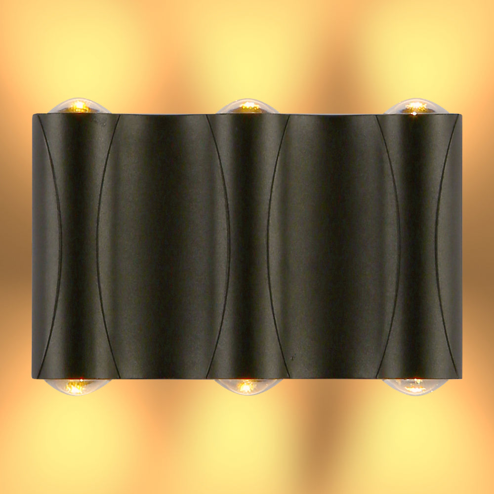 Aplique de pared LED moderno en forma de lumbrera corrugada, ideal para exteriores en decoraciones contemporáneas.