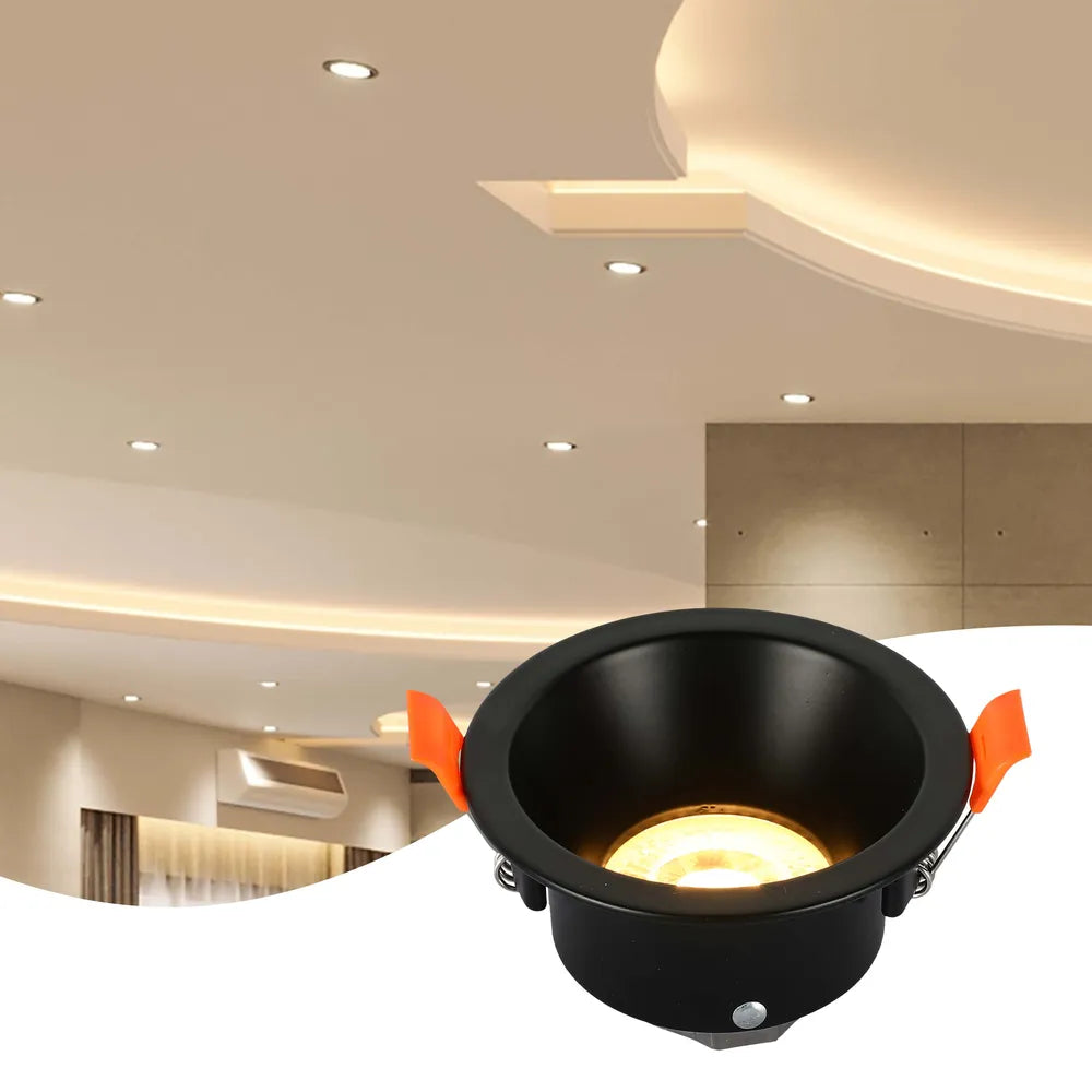 La luminaria empotrada GU10 elegante ilumina una sala de estar moderna con una decoración estilosa, proporcionando un ambiente cálido en un entorno acogedor.143-03996