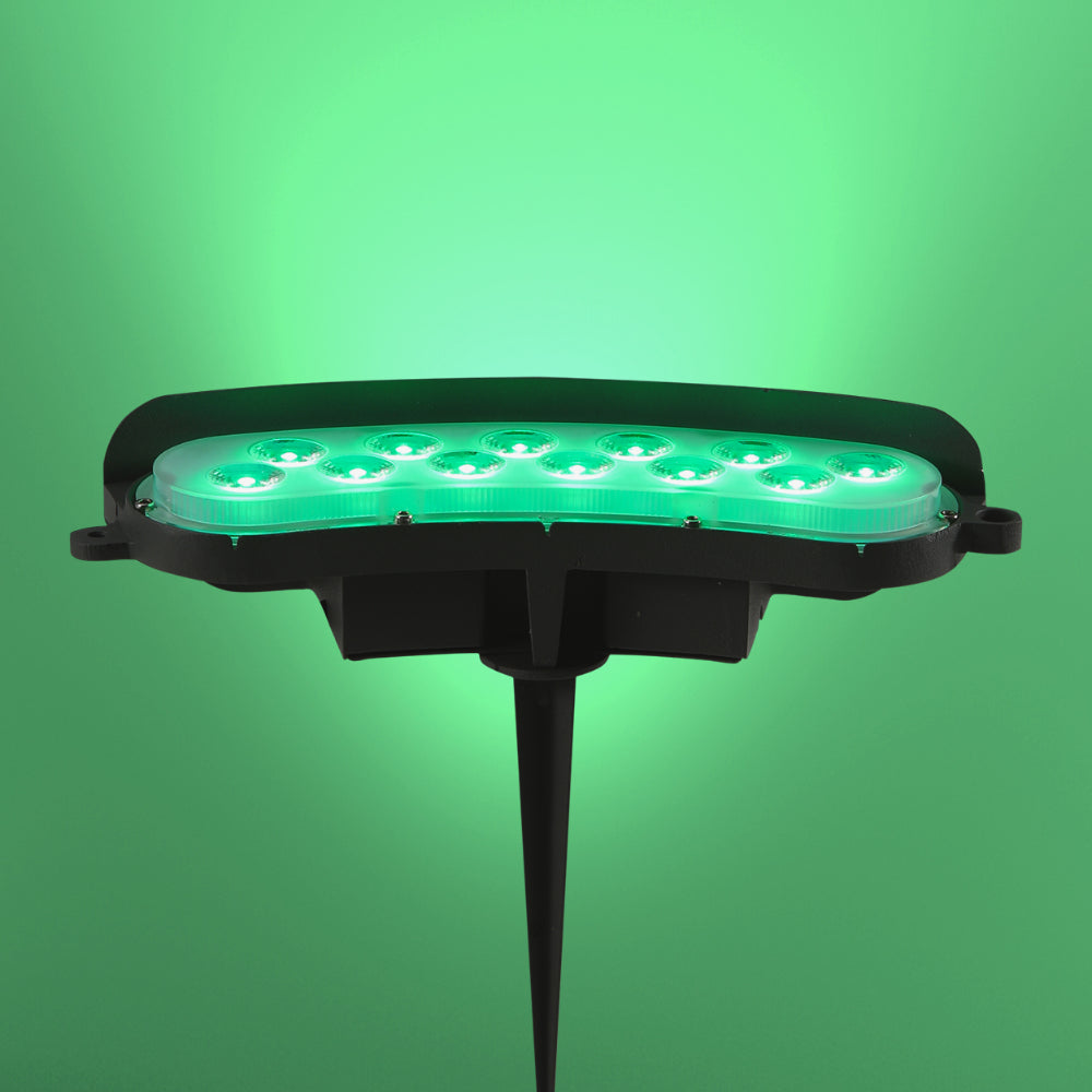 Foco LED de 12W ideal para exteriores, perfecto para jardines con estilo contemporáneo, ofreciendo luz cálida o verde.