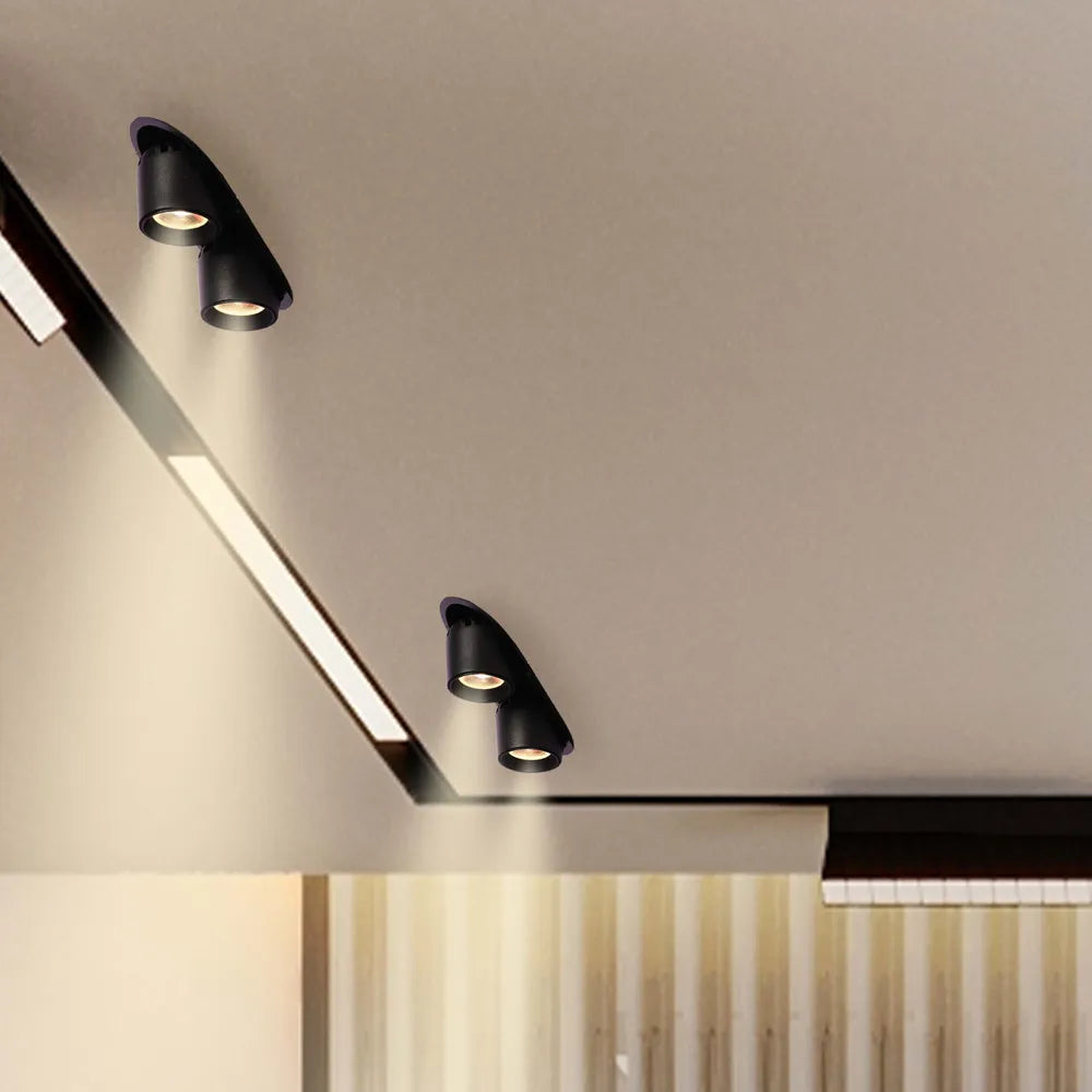 Downlight LED moderno en una sala de estar elegante, que se integra perfectamente con la decoración contemporánea y proporciona iluminación ajustable para un mejor ambiente.143-03412