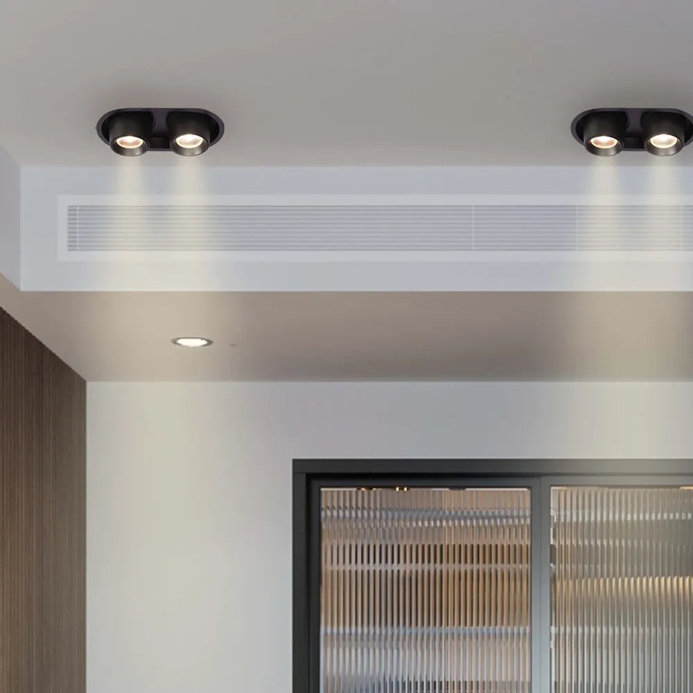 Moderno downlight LED con diseño de cardán ajustable, iluminando perfectamente una sala de estar contemporánea con elegantes elementos de decoración.143-03412