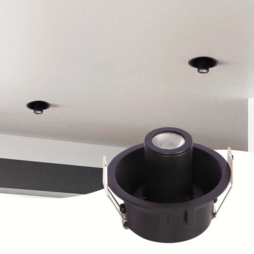 Luz empotrada LED elegante en sala de estar moderna, integrándose perfectamente con la decoración contemporánea para una iluminación estilizada y eficiente.143-03420