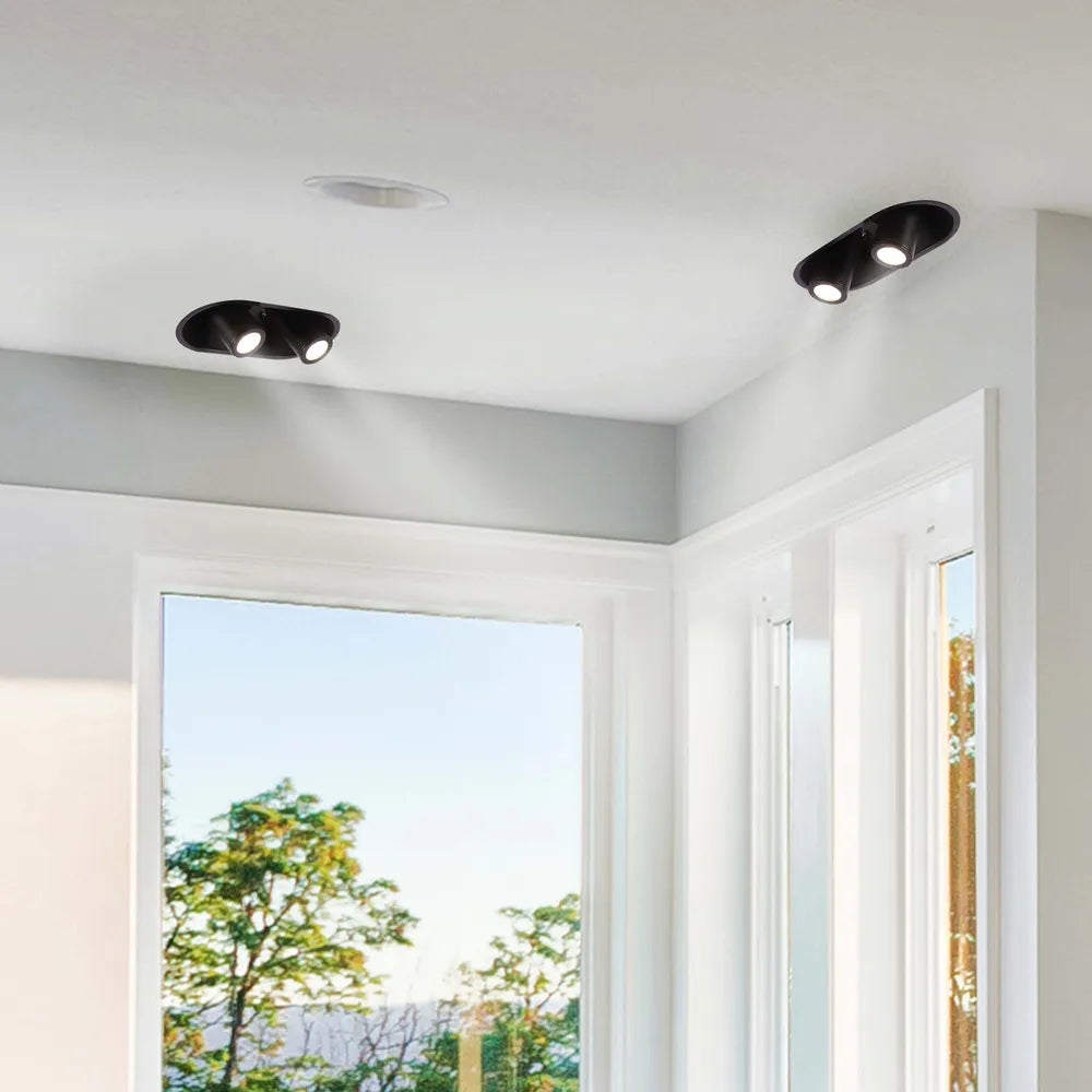 Downlight LED moderno en una acogedora sala de estar, mejorando la decoración con un cabezal ajustable para iluminación dirigida y estilo.143-03422