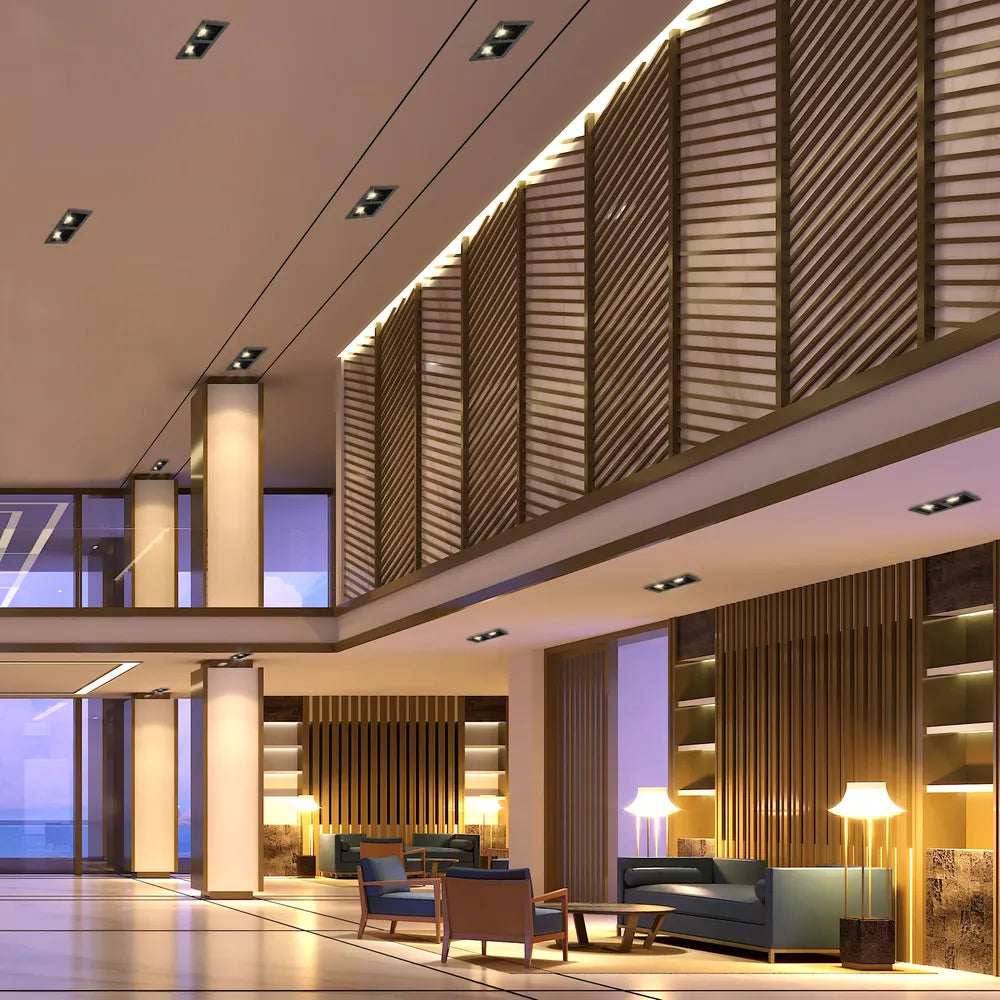 Una elegante luminaria empotrable GU10 iluminando una sala de estar moderna con decoración minimalista, realzando la atmósfera contemporánea del espacio.143-03446