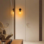 Lámpara de pared de vidrio transparente y latón antiguo con cadena de tracción