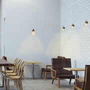 Lámpara de pared de vidrio ámbar en forma de cono, perfecta para espacios modernos y acogedores, con interruptor de tirón.