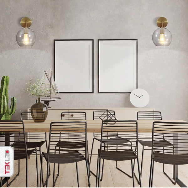 Indoor setting of Gold Aluminium Bronze Body Clear Glass Globe Wall Light with E27 Fitting