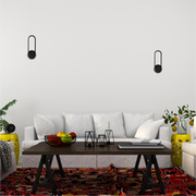 Aplique mural LED en forma de óvalo, ideal para espacios modernos y sofisticados, perfecto para salones o pasillos elegantes.