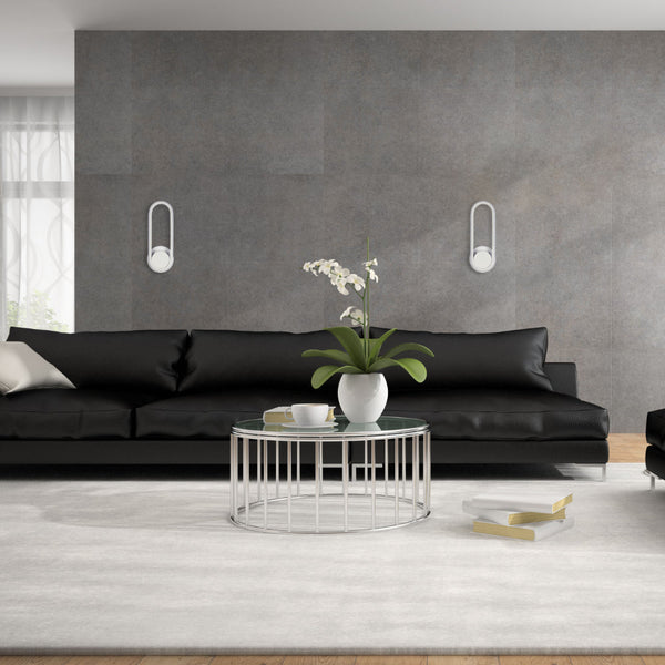 Aplique de pared LED en forma elíptica negra, ideal para iluminación ambiental en salas de estar con estilo contemporáneo.