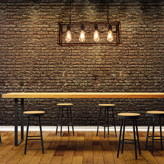 Lámpara de araña de metal en estilo industrial, ideal para comedores rústicos, con cuatro luces que aportan un ambiente acogedor.