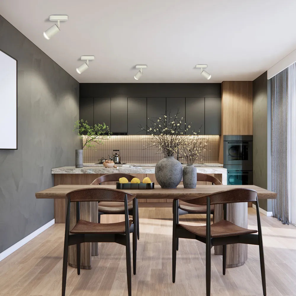 El moderno foco LED circular mejora armoniosamente una sala de estar minimalista con decoración elegante y iluminación focalizada.172-03031