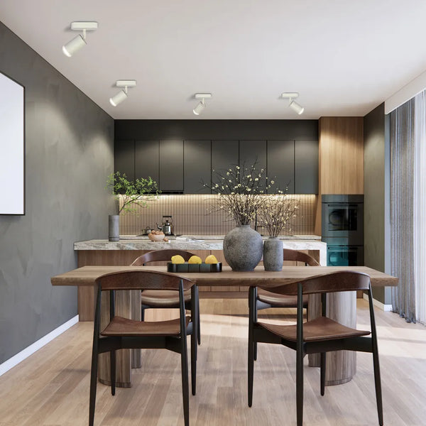 El moderno foco LED circular mejora armoniosamente una sala de estar minimalista con decoración elegante y iluminación focalizada.172-03031