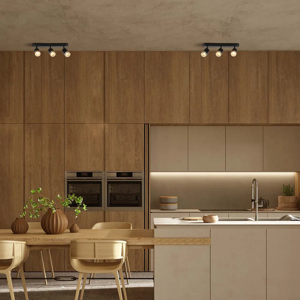 Foco circular GU10 iluminando una sala de estar moderna con decoración elegante e iluminación ambiental.172-03037