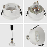Detalle en primer plano de un downlight empotrado moderno de aluminio, ideal para oficinas con decoración contemporánea.