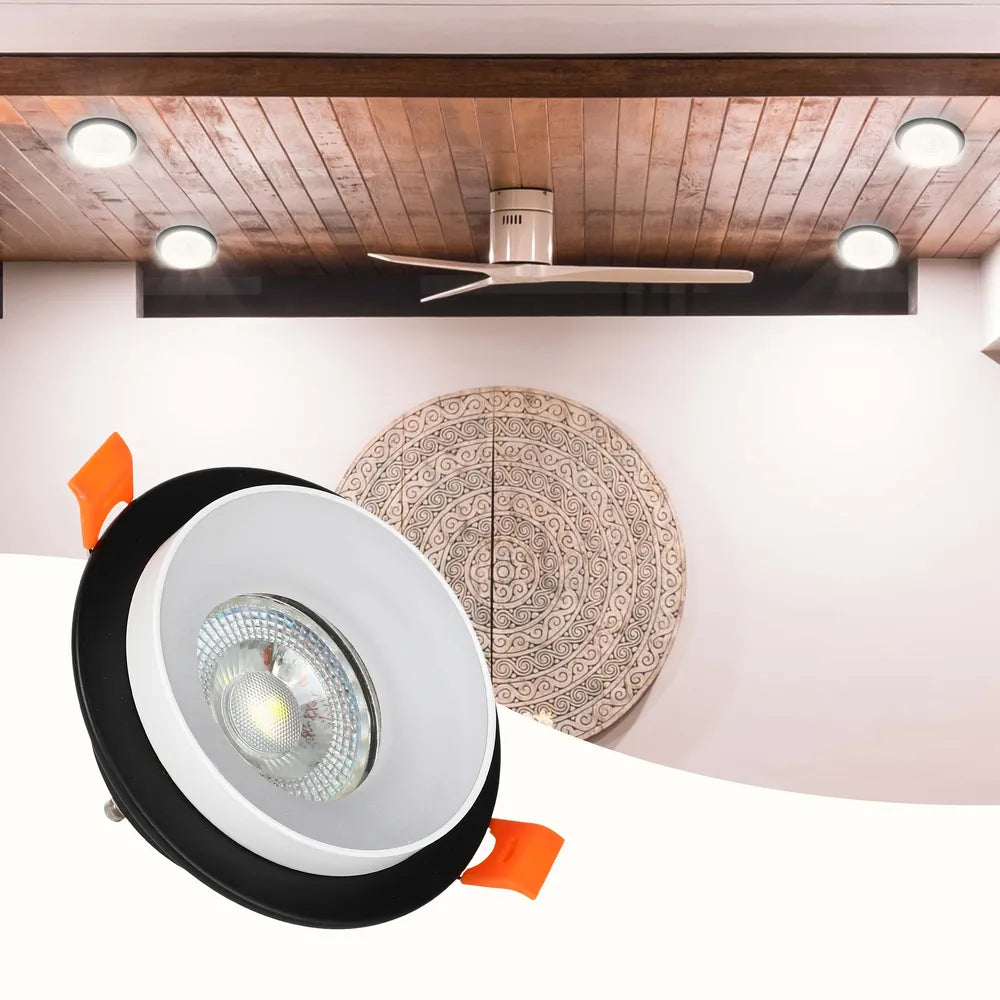 La luminaria empotrable GU10 de diseño elegante ilumina una sala de estar moderna con decoración contemporánea, mejorando el ambiente y el estilo. 143-03430