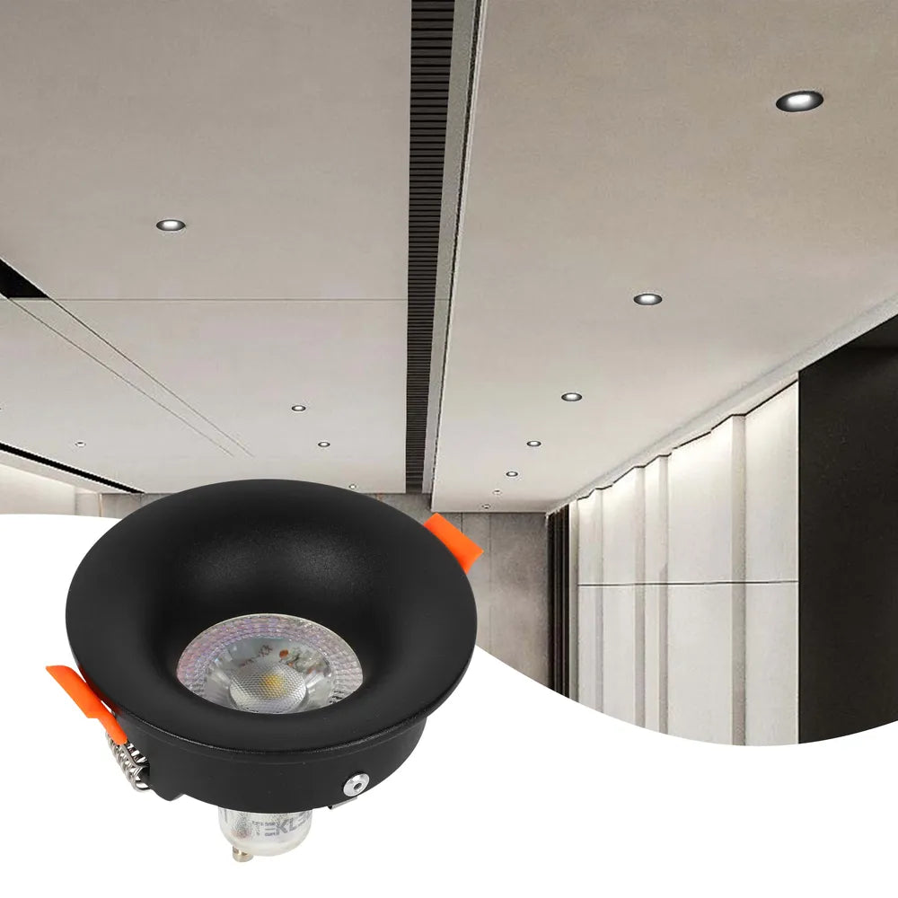 Foco empotrable GU10 en sala de estar moderna, proporcionando iluminación de bajo deslumbramiento y realzando la decoración contemporánea sin esfuerzo.143-03992
