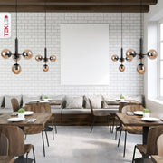 Interior application of Atom Model Amber Globe Glass Black Metal Body Chandelier with 4xE27 Fittings | TEKLED 159-17406