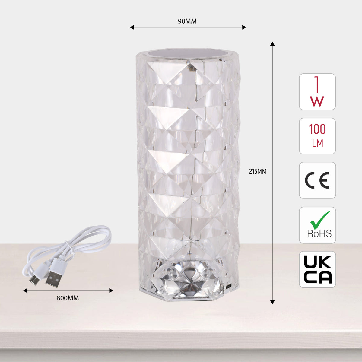 Lámpara cilíndrica recargable con acabado de cristal, perfecta para mesas en salones modernos y decoración contemporánea.