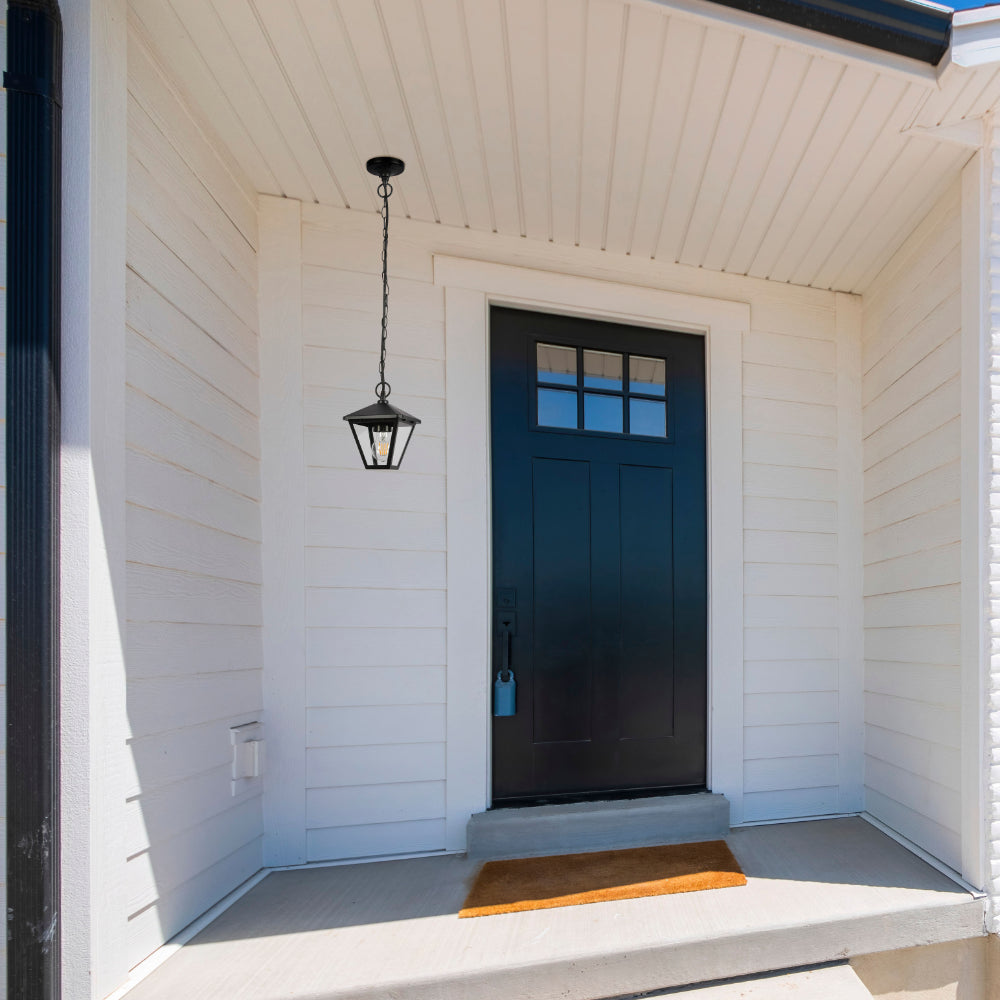 Lámpara colgante exterior en diseño moderno, ideal para terrazas o patios, con estructura negra y uso de bombilla E27.