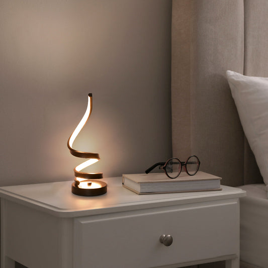 Lámpara de mesa LED en espiral contemporánea con acabado negro, ideal para estudios modernos y espacios de trabajo.