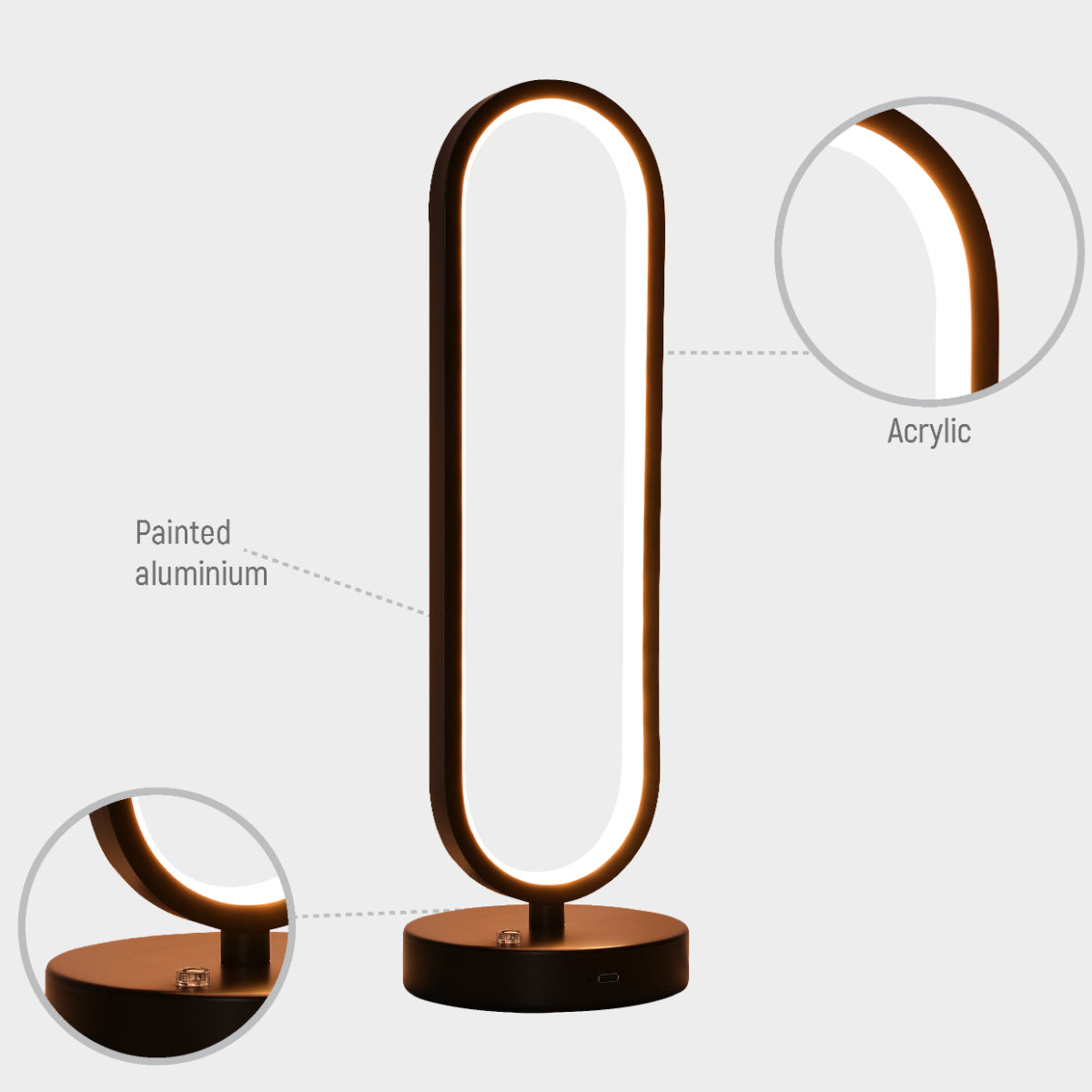 Lámpara de mesa ovalada minimalista con acabado negro y LED CCT ajustable, perfecta para oficinas con decoración contemporánea.