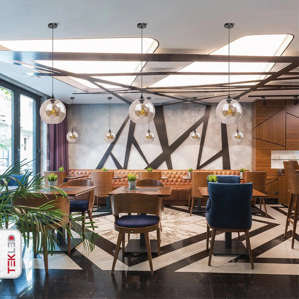 Smoky glass globe pendant light with e27 fitting in indoor setting kitchen
