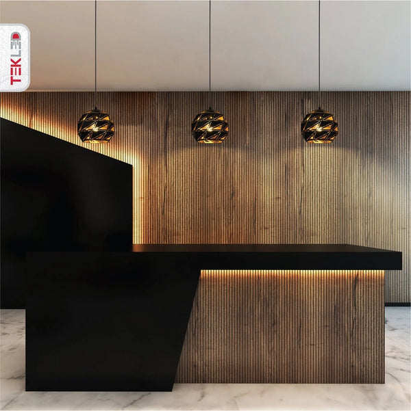 Black-golden metal polyhedral pendant light s with e27 fitting in an indoor setting triple usage