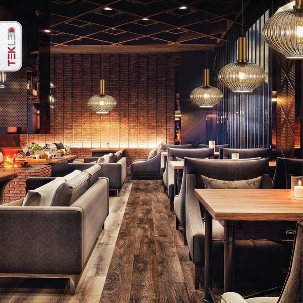 Golden bronze metal amber glass globe pendant light s with e27 fitting in indoor setting cafe