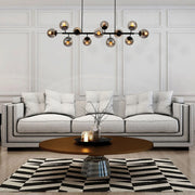 another living room design for Modern Molecule Style Amber Smoky Opal Glass Globe Gold Black Metal Body Island Chandelier Ceiling Light E27