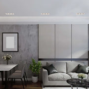Moderno aparato de iluminación empotrado GU10 que ilumina una sala de estar elegante y contemporánea con una decoración minimalista y un ambiente cálido y acogedor.143-03405