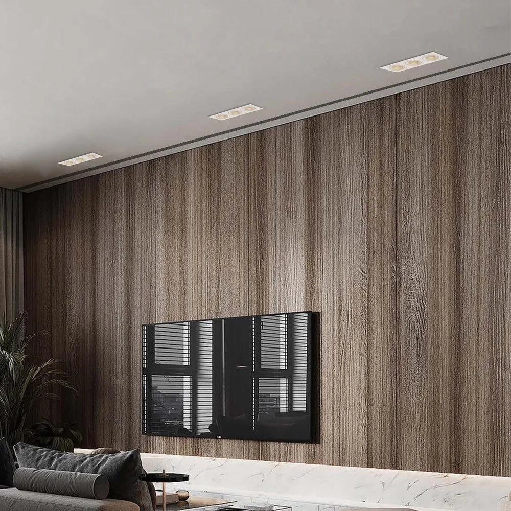 El elegante aparato de iluminación empotrable GU10 ilumina una sala de estar moderna con una decoración contemporánea, mejorando el ambiente y el estilo.143-03405