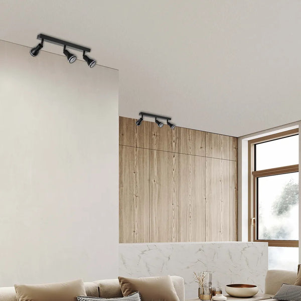 Foco moderno GU10 iluminando una sala de estar elegante con una decoración minimalista, mejorando el ambiente acogedor y el diseño elegante.172-03212