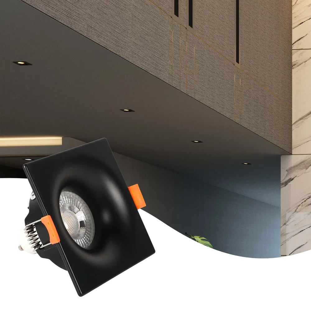 La luminaria empotrable GU10 ilumina una sala de estar moderna con decoración minimalista, proporcionando una iluminación cálida y sin reflejos para un ambiente acogedor.143-03994