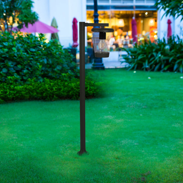 Luz de camino exterior en diseño moderno, ideal para jardines y senderos, con estructura de metal gris oscuro y base robusta.