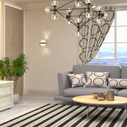 Luz de pared decorativa moderna de tres fuentes, ideal para salas y entradas con estilo contemporáneo.