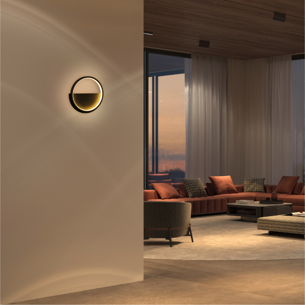 Imagen de luz de pared LED redonda negra, perfecta para espacios modernos como pasillos o salas de estar.