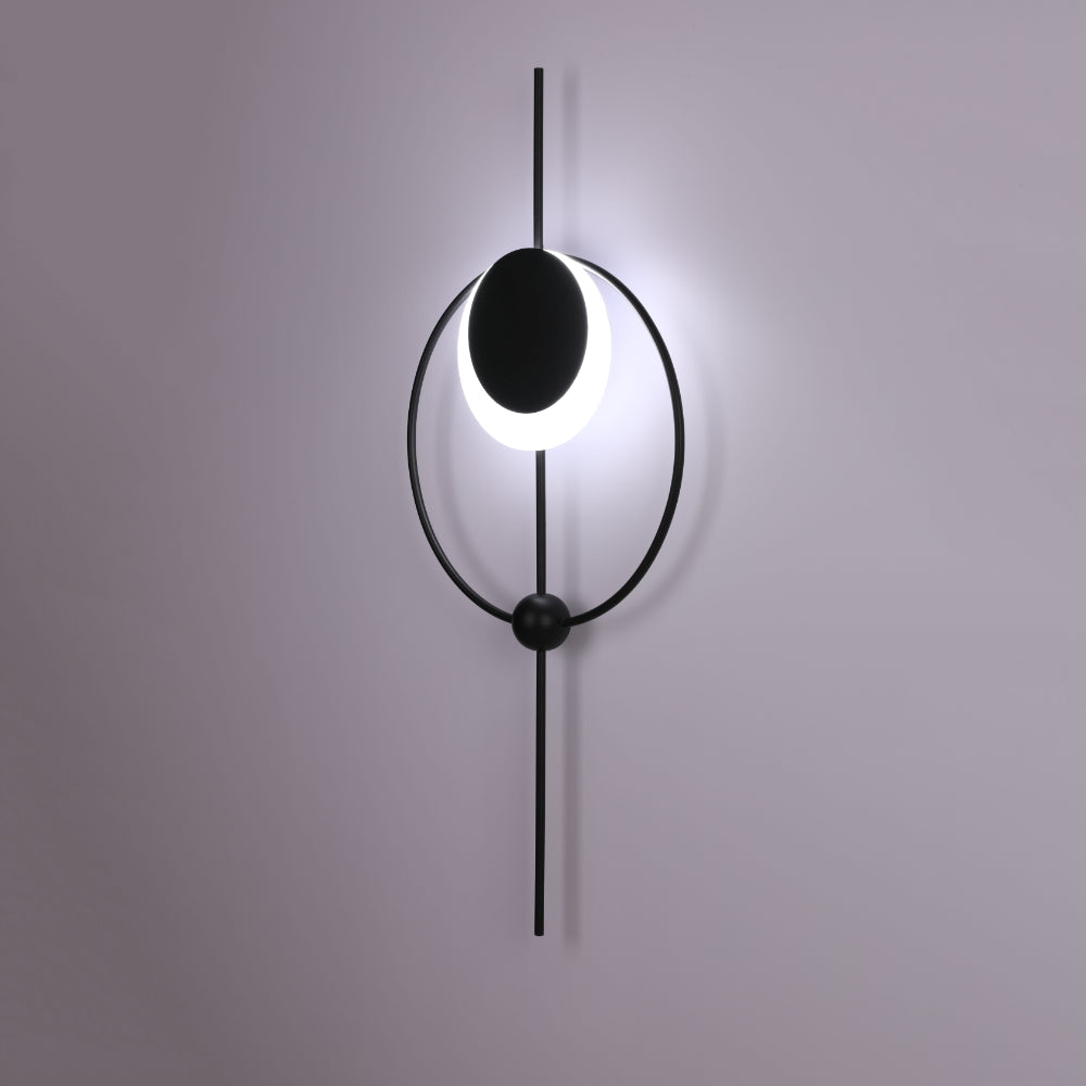 Luz de pared LED moderna con diseño geométrico de luna en círculo, ideal para decoración contemporánea en salones o dormitorios.