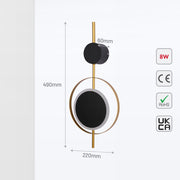 Luz de pared LED moderna en diseño geométrico negro y círculo dorado, ideal para salas con estilo contemporáneo.