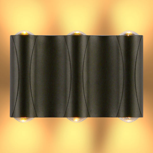 Aplique de pared LED moderno en forma de lumbrera corrugada, ideal para exteriores en decoraciones contemporáneas.