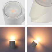 Detalle del aplique de pared LED rotatable, ideal para exteriores, combinando diseño moderno en espacios al aire libre.
