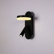Luz LED de lectura de pared en forma de halo, ideal para la iluminación de mesitas en dormitorios contemporáneos.
